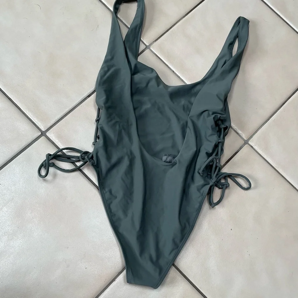 Olive green one piece in medium - Picture 2 of 2